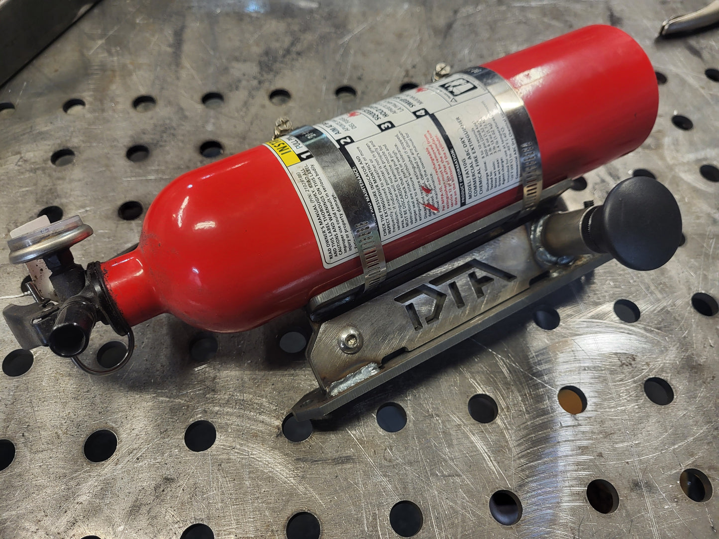 Quick Release Fire Extinguisher Mount (RAW, NON POWDER COATED)